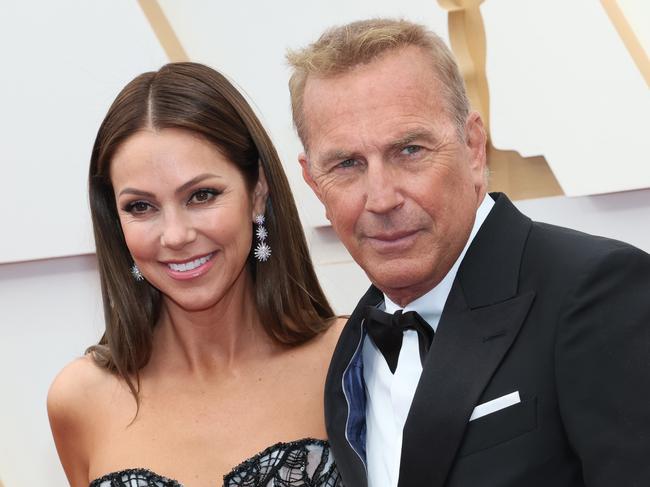 HOLLYWOOD, CALIFORNIA - MARCH 27: (L-R) Christine Baumgartner and Kevin Costner attend the 94th Annual Academy Awards at Hollywood and Highland on March 27, 2022 in Hollywood, California. (Photo by David Livingston/Getty Images)