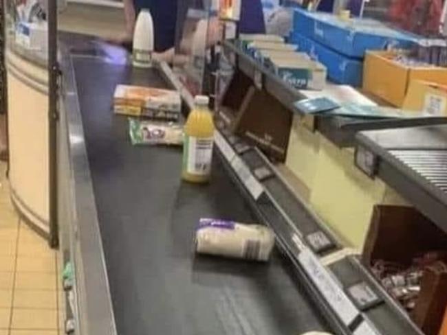 One shopper shared a photo of their groceries purposefully spaced out in an attempt to slow down the scanning process. Picture: Facebook/Aldi Fans Australia.