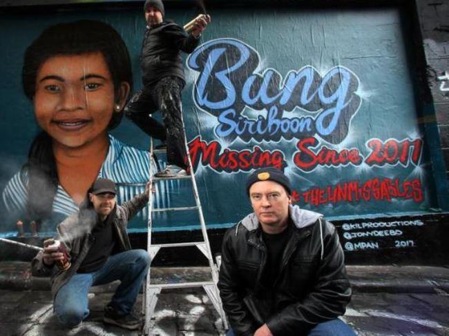 Artists Ashley Goudie &amp; Jonny Deel painted the mural of Bung Sriboon. Picture: Yuri Kouzmin