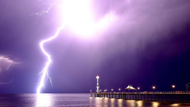 Lightning cracks the night sky over Brighton’s jetty in Adelaide. Picture: Rick Beal