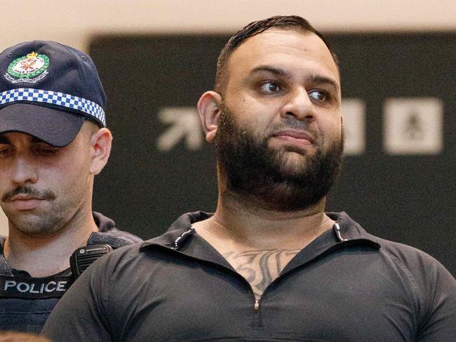 DAILY TELEGRAPH EXCLUSIVE - NO AUSTRALIAN, NO NEWS.COM.AU. . Federal police escort fugitive Alameddine crime figure Masood Zakaria out of Sydney Domestic Airport after he was deported from Turkey. Tuesday 05/12/2023. Picture by Max Mason-Hubers