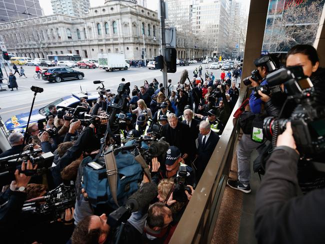 Cardinal George Pell walks into court surrounded by police. Picture: Michael Dodge/Getty