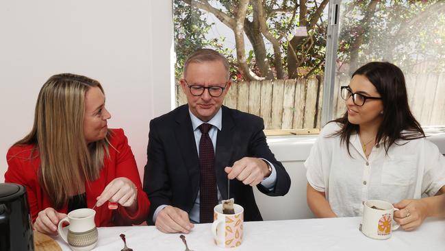 Labor leader Anthony Albanese and his partner Jodie Haydon talk with Lydia Pulley over a cup of tea. Lydia is a renter struggling to save to enter the housing market. Picture: Liam Kidston