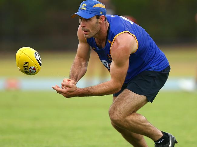 PERTH, AUSTRALIA - DECEMBER 04: Shannon Hurn handballs during a West Coast Eagles AFL pre-season training session at the WA Athletics Stadium on December 4, 2017 in Perth, Australia.  (Photo by Paul Kane/Getty Images)