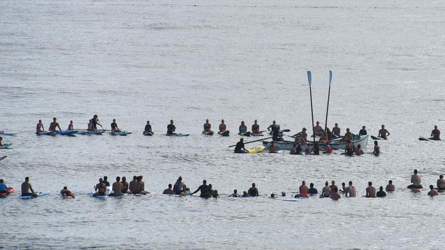 Locals form a circle of honour for Johnny Munro. Picture: Supplied