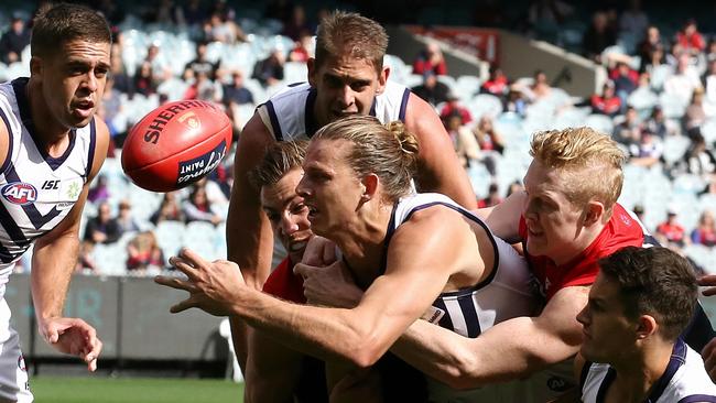 Nat Fyfe is tackled by Jack Viney and Clayton Oliver. Picture: Wayne Ludbey