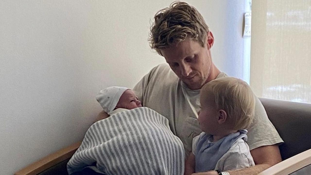 AFL star Rory Sloane introduces new child Bodhi to big brother Sonny.