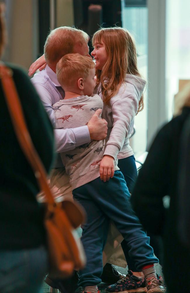 Brendon Hunt with his children Holly, 7, and Stephen, 6, at Sydney Airport ahead of the Queensland border reopening. Picture:Justin Lloyd