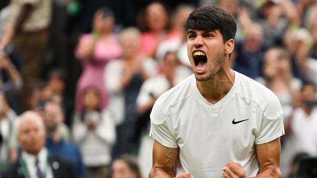 Spain's Carlos Alcaraz celebrates winning against to US player Frances Tiafoe. (Photo by Glyn KIRK / AFP)