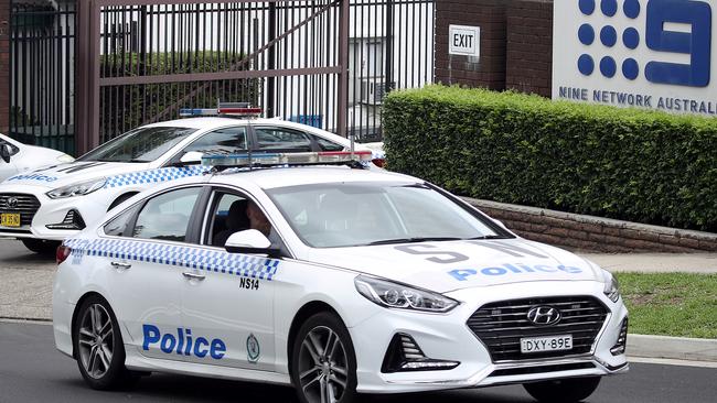 Police leave Channel 9 after an alleged threat was made against Mikey Pembroke. Picture: DIIMEX