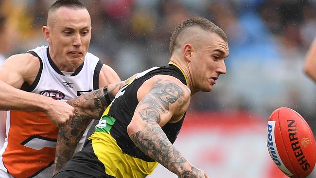 Dustin Martin battles the Giants’ Tom Scully. Picture: Julian Smith (AAP)