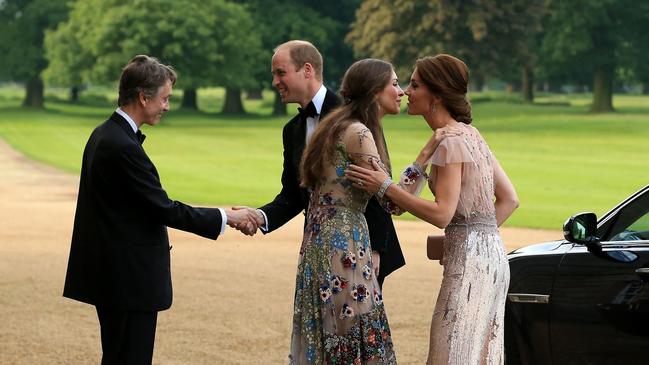 Prince William and Kate are greeted by David Cholmondeley and his wife, Rose Hanbury, as they arrive at a gala dinner at their home in 2016. Picture: Stephen Pond/Getty Images