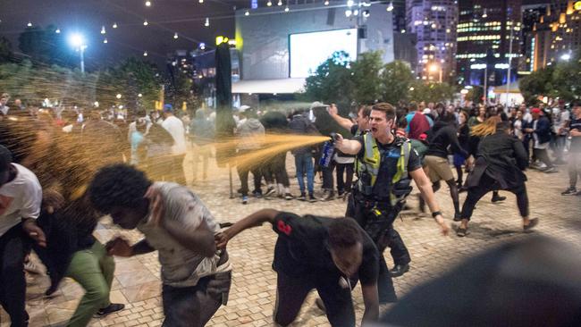 Police use capsicum spray during the Moomba riots. Picture: Jake Nowakowski