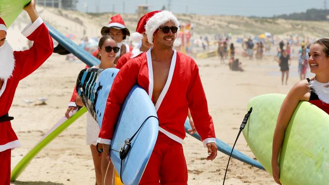 Australian professional surfer Connor O'Leary and his friends going for their traditional Christmas Eve surf at Elouera Beach in Cronulla. Picture: Jonathan Ng