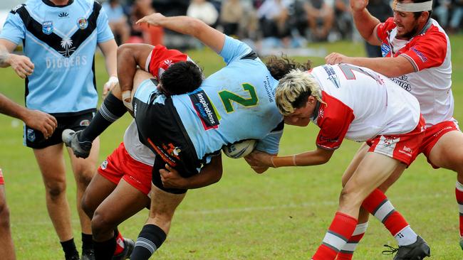 Woolgoolga winger Kade Levingstone met in a heavy tackle. Picture: Leigh Jensen