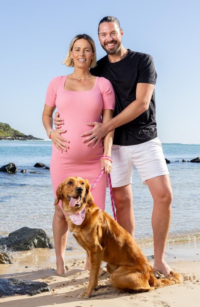 Courtney Hancock and Nick Buchanan have announced they are expecting a baby. Pictured with dog Bambi. Picture: Luke Marsden.