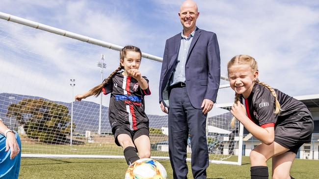 Eloise Beard and Lucy Holeywell, both 9 from the Zebras, and CEO of Football Tasmania’s Matt Bulkeley. Picture: RICHARD JUPE