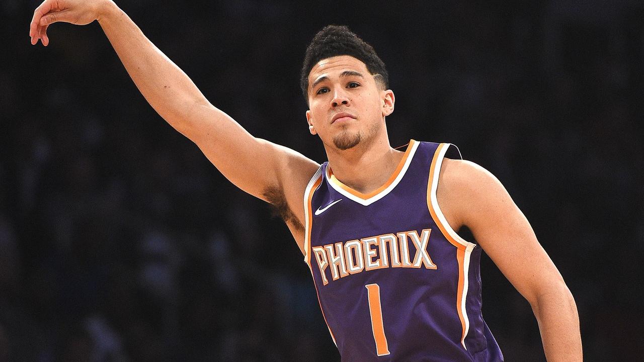 Devin Booker presented award by Sarver, calls Suns over for team picture