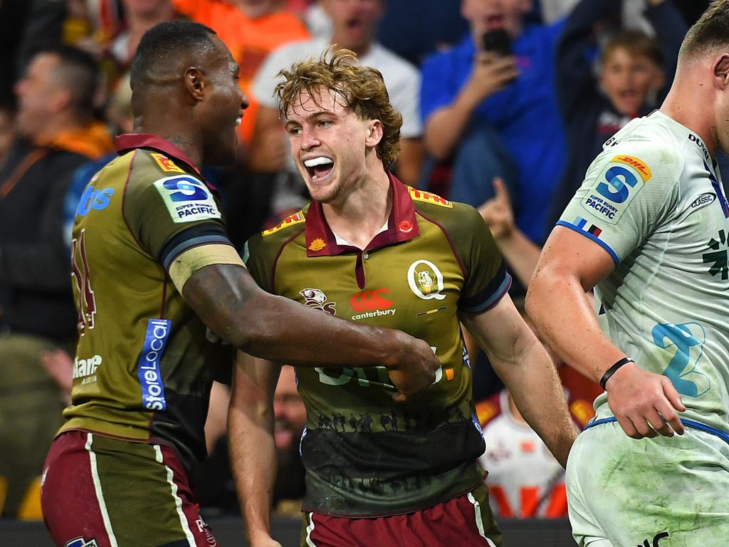 Reds debutant Tim Ryan celebrates with Suliasi Vunivalu after scoring a try during the round 10 Super Rugby Pacific match between Queensland Reds and Blues at Suncorp Stadium, on April 27, 2024, in Brisbane, Australia. (Photo by Albert Perez/Getty Images)