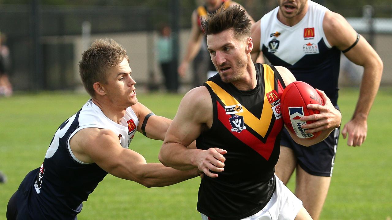 Ballarat: Aaron Willitts of Bacchus Marsh can’t escape Melton South’s William Thornton-Gielen. Picture: Hamish Blair