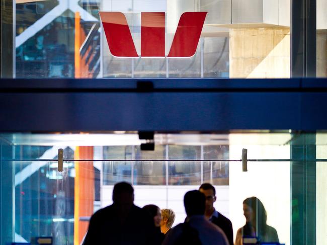 The Westpac Banking Corp. logo is displayed above the entrance to the company's Kent Street offices in Sydney, Australia, on Thursday, May 3, 2012. Westpac, Australia's second-biggest bank, reported the smallest increase in first-half profit since 2009 as competition to attract deposits squeezed margins. Photographer: Ian Waldie/Bloomberg