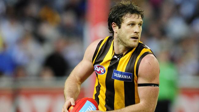 Campbell Brown playing for Hawthorn on the MCG.