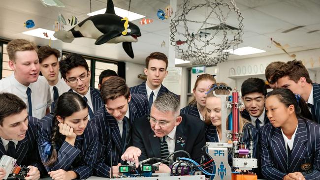 Students and a teacher at Sheldon College, Queensland which runs the Science of Rockets program with advanced manufacturing company PFI, who started the program after struggling to find skilled graduates.