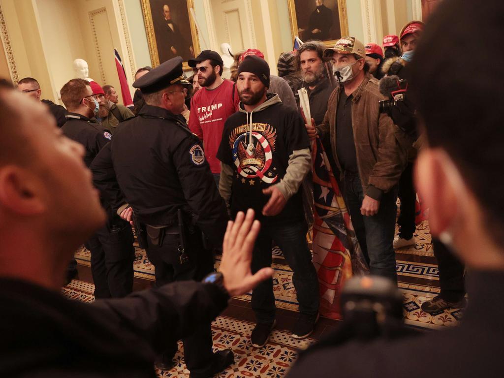 Protesters interact with Capitol Police inside the Capitol Building. Picture: Getty Images/AFP