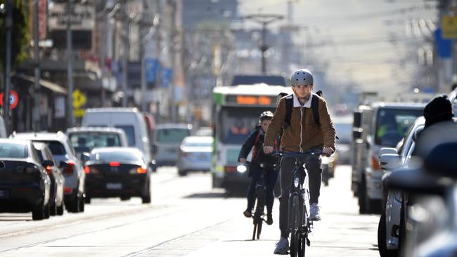 Cyclists on Sydney Rd in Brunswick. Picture: Andrew Henshaw