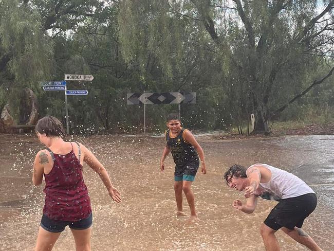 Hawker Hotel Motel patrons have fun in the summer rain , 15 Jan  2024 . Picture: Hawker Hotel Motel