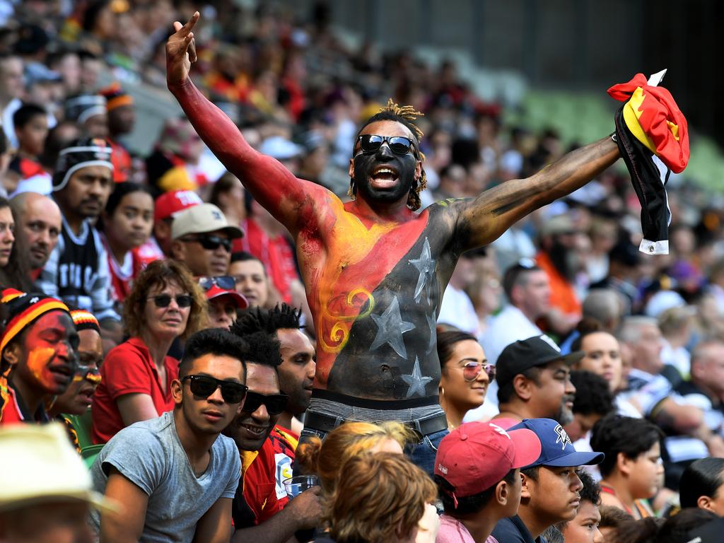 Fans in PNG are obsessed with footy. Picture: AAP Image/Joe Castro