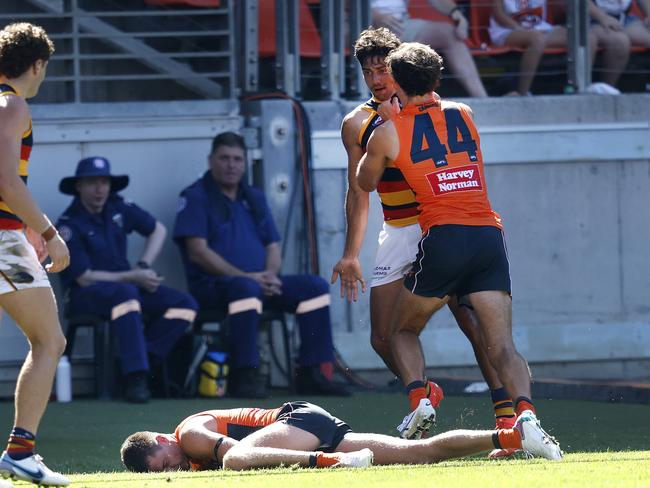 Adelaide's Shane McAdam late hit on Giants Jacob Wehr during the Round 1 AFL match between the GWS Giants and the Adelaide Crows at Giants Stadium. Picture: Phil Hillyard