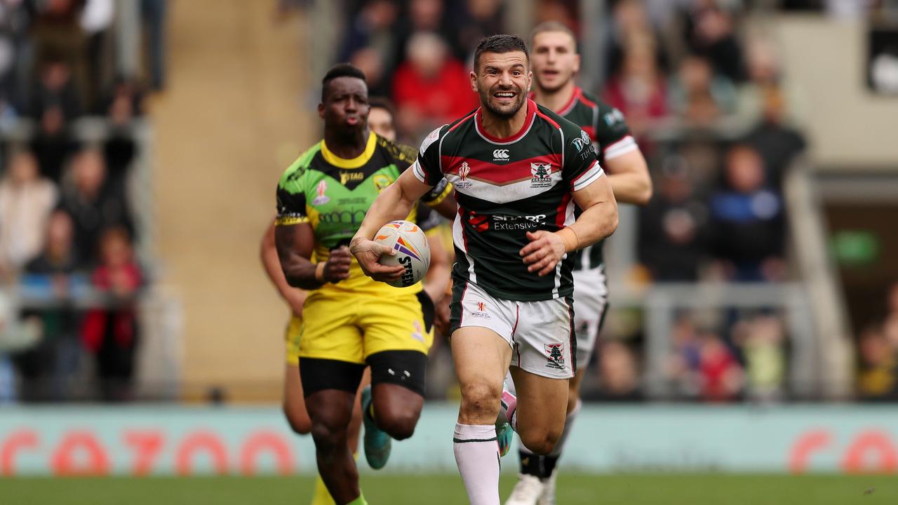 LEIGH, ENGLAND - OCTOBER 30: Josh Mansour of Lebanon runs on to score their sides eleventh try during Rugby League World Cup 2021 Pool C match between Lebanon and Jamaica at Leigh Sports Village on October 30, 2022 in Leigh, England. (Photo by Charlotte Tattersall/Getty Images for RLWC)