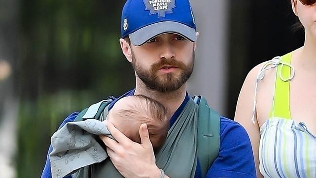 Harry Potter star Daniel Radcliffe and his longtime partner Erin Darke are spotted out for a Father's Day stroll with their baby in the West Village. Picture: T.JACKSON/R.O'Neil / BACKGRID