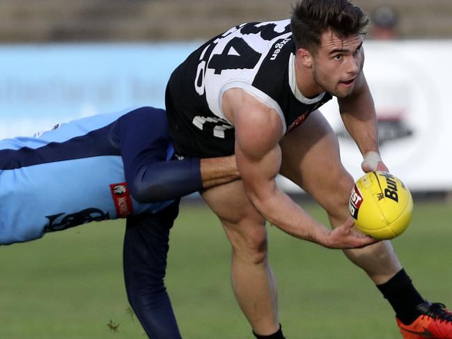 17/06/18 - SANFL - Port Adelaide v Sturt at Alberton Oval. Will Snelling under pressure from Fraser Evans. Picture Sarah Reed