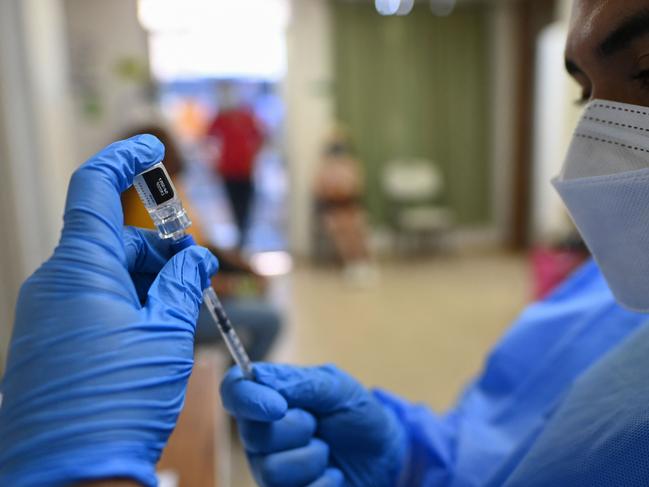 A nurse prepares a dose of the Pfizer-BioNTech vaccine against COVID-19 amid the novel coronavirus pandemic, in Taboga Island, Panama on May 21, 2021. - The Panamanian island of Taboga is free of covid-19 and its population completed the vaccination against the coronavirus,  the Ministry of Health announced. All the population over 16 years of age, pregnant women, teachers, were vaccinated, and this makes a coverage of about 1,800 people on the island, which also includes the islands of Otoque East and Otoque West. (Photo by Luis ACOSTA / AFP)