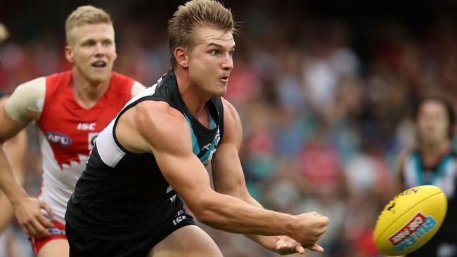 Ollie Wines, Port’s best against Sydney, fires out a handpass at the SCG. Picture: Mark Kolbe (Getty Images)