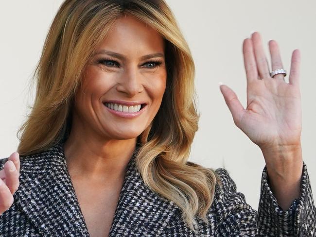 US President Donald Trump and First Lady Melania Trump wave after taking part in the annual Thanksgiving turkey pardon in the Rose Garden of the White House in Washington, DC on November 24, 2020. (Photo by MANDEL NGAN / AFP)