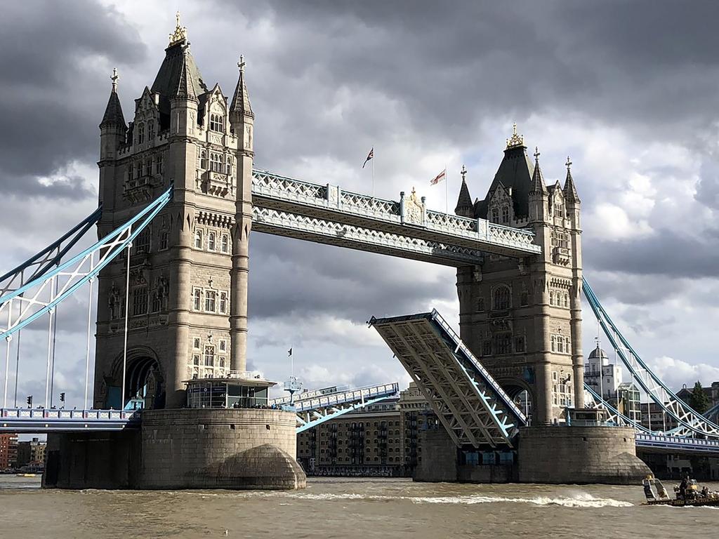 Tourists and locals were stunned when the famous Tower Bridge got stuck open. Picture: @1scottishladdie/AFP