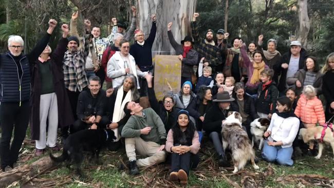 Residents and supporters at the community blockade at Avalon Beach on Friday to prevent Northern Beaches Council contractors from cutting down two 70-years gum trees in Ruskin Rowe. Picture: Jim O’Rourke