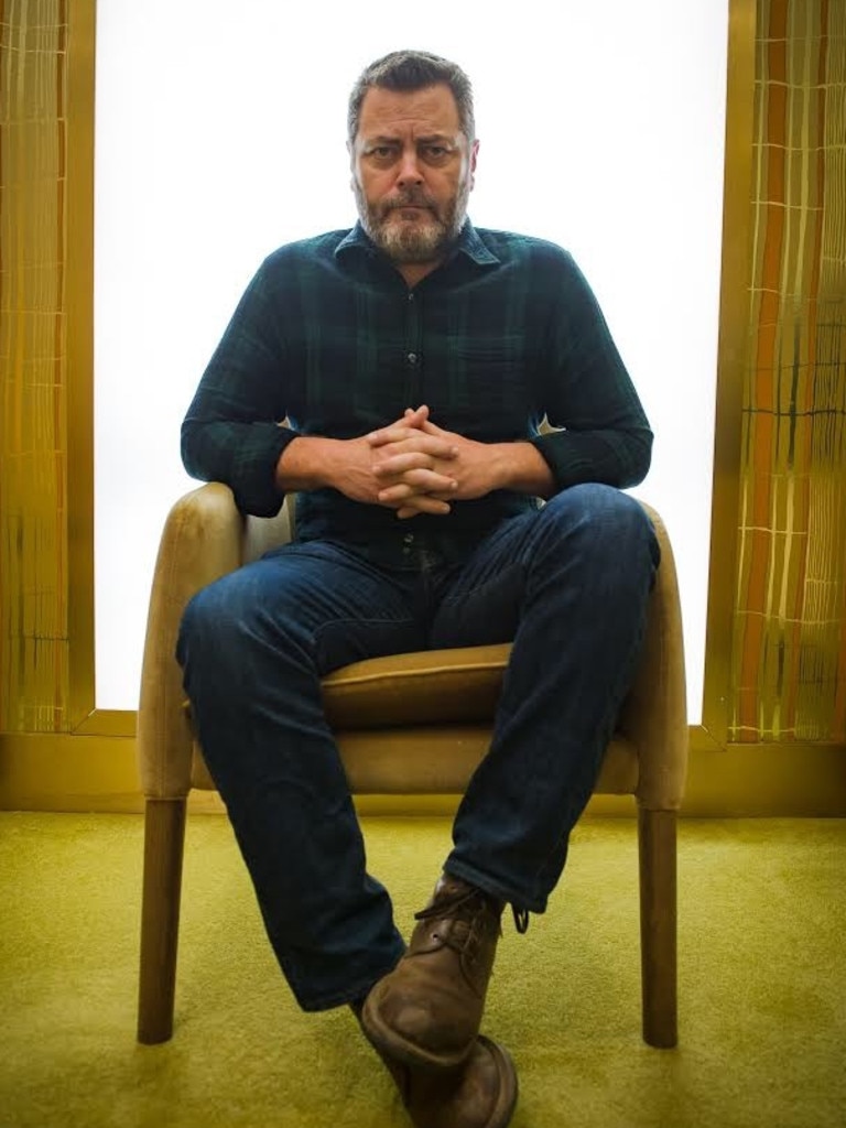 Stand up comedian (sitting down) Nick Offerman.