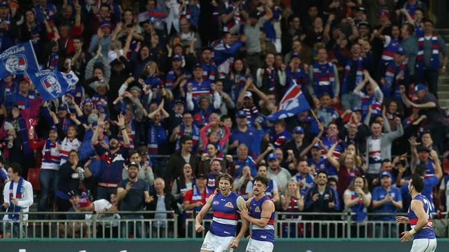 Western Bulldogs fans celebrate after Marcus Bontempelli kicks a goal during the AFL preliminary final against Greater Western Sydney. Picture: AAP