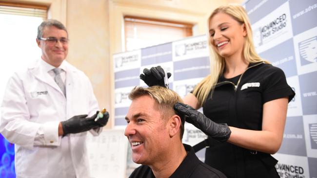 Shane Warne was not afraid to be front and centre for Advanced Hair Stuido. Picture: AAP Image/Julian Smith