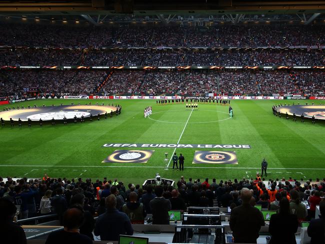 Players, fans, and officials take part in a minutes silence in memory of the victims of the Manchester Concert attack