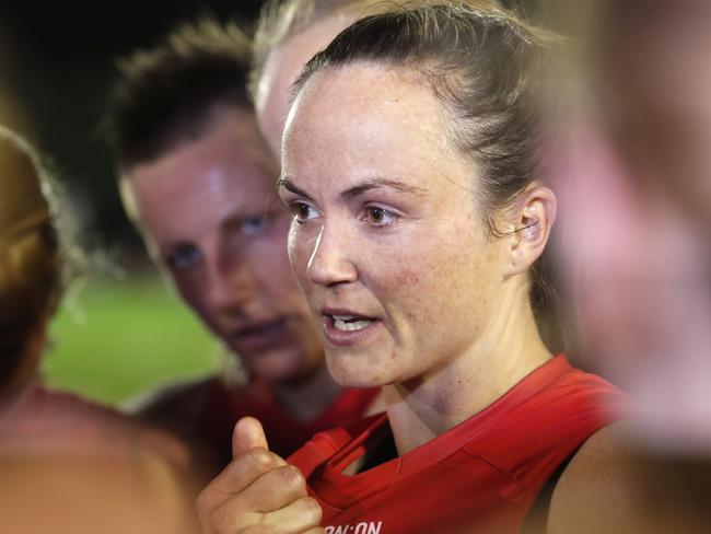 MELBOURNE, AUSTRALIA - MARCH 13: Daisy Pearce of the Demons speaks to her players after a win during the 2021 AFLW Round 07 match between the Melbourne Demons and the Adelaide Crows at Casey Fields on March 13, 2021 in Melbourne, Australia. (Photo by Dylan Burns/AFL Photos via Getty Images)