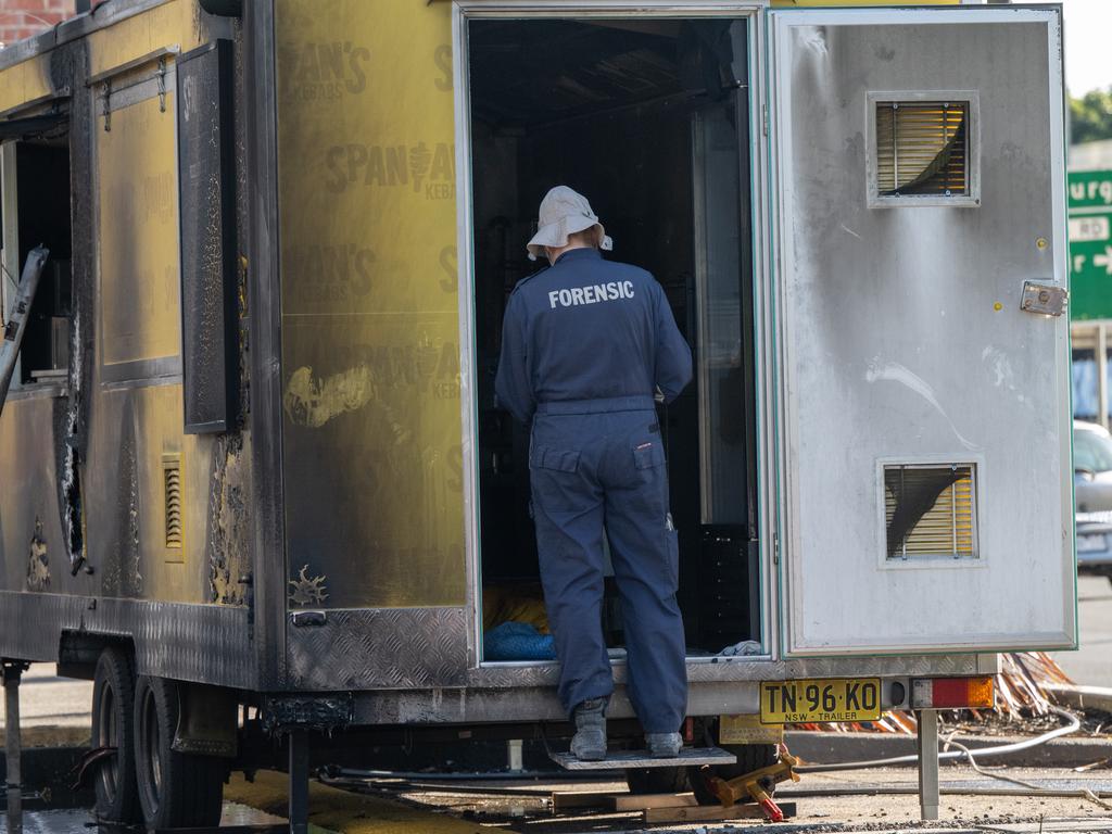 Police investigate the crime scene. Picture: Tony Gough