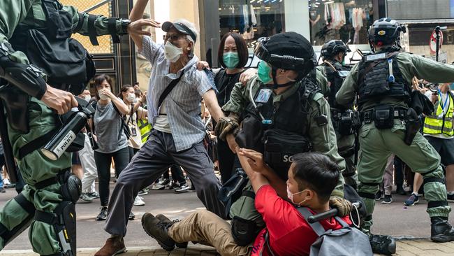 Hong Kong pro-democracy supporters scuffle with riot police in 2020. Picture: Anthony Kwan