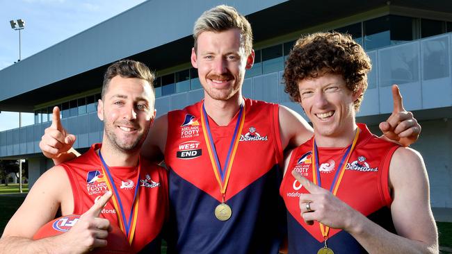 Lockleys players Liam Narcy, who kicked the winning goal for the A grade, Chad Hamilton from the B grade and A grade best on ground medallist Brad Broughton celebrating the club’s premierships last year. Picture: Mark Brake