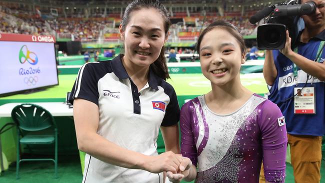 Their countries are at war but these two gymnasts have captured the Olympic spirit with a selfie. Picture: Kim Do-hoon/Yonhap via AP