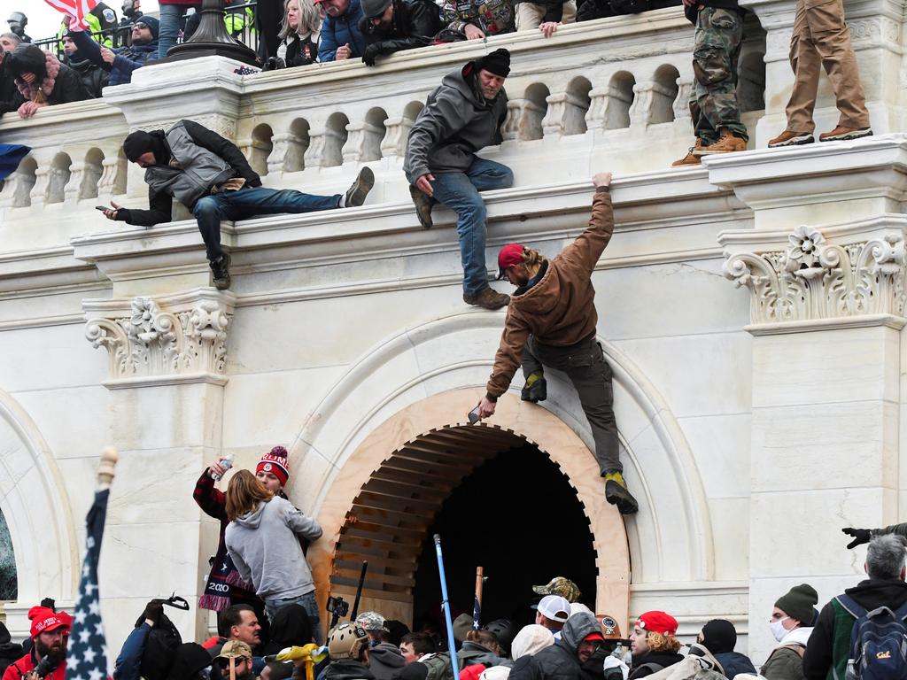 Trump’s supporters wanted him to Build A Wall, but they climbed others to storm the Capitol in a bid to preserve his power. Picture: Reuters